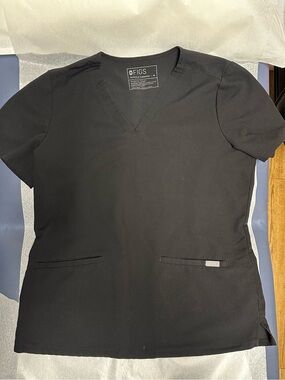 Figs Black Casma 3 pocket scrub top. Medium. Small stain on bottom on top.